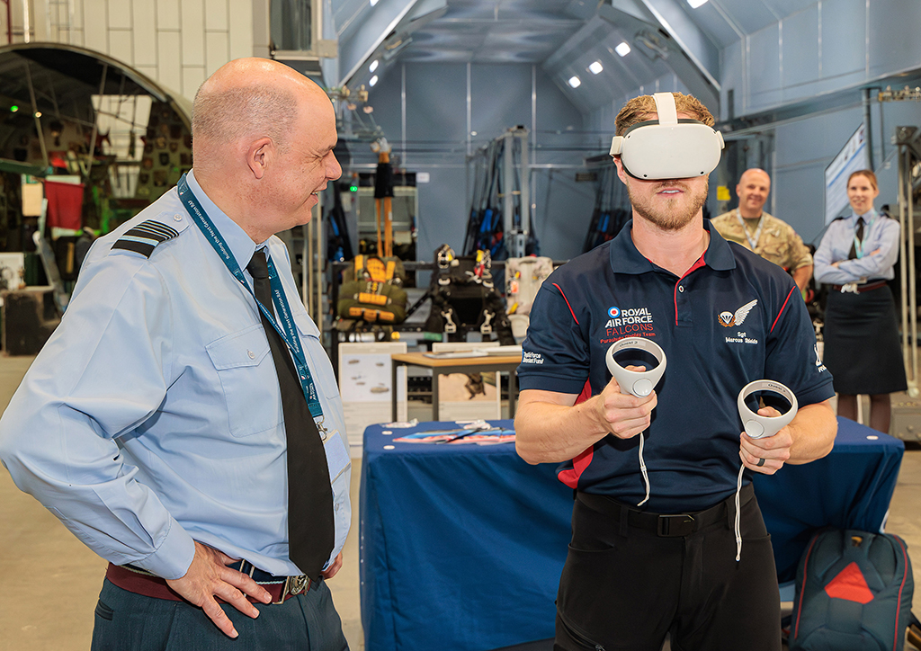 The Deputy Chief of the Air Staff, Air Marshal Paul Lloyd CBE MSc MA MDA BEng CEng FIMechE RAF, being introduced to the Virtual Reality Falcons Display